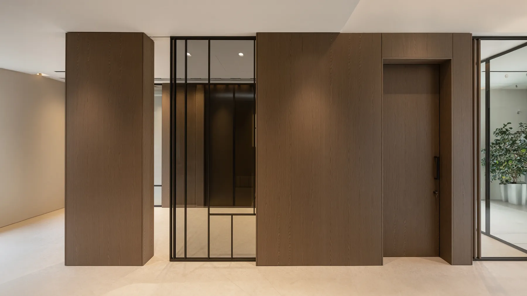 Sliding doors integrated into wall paneling